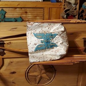 Cow Hide with metallic rose gold purse with fringe